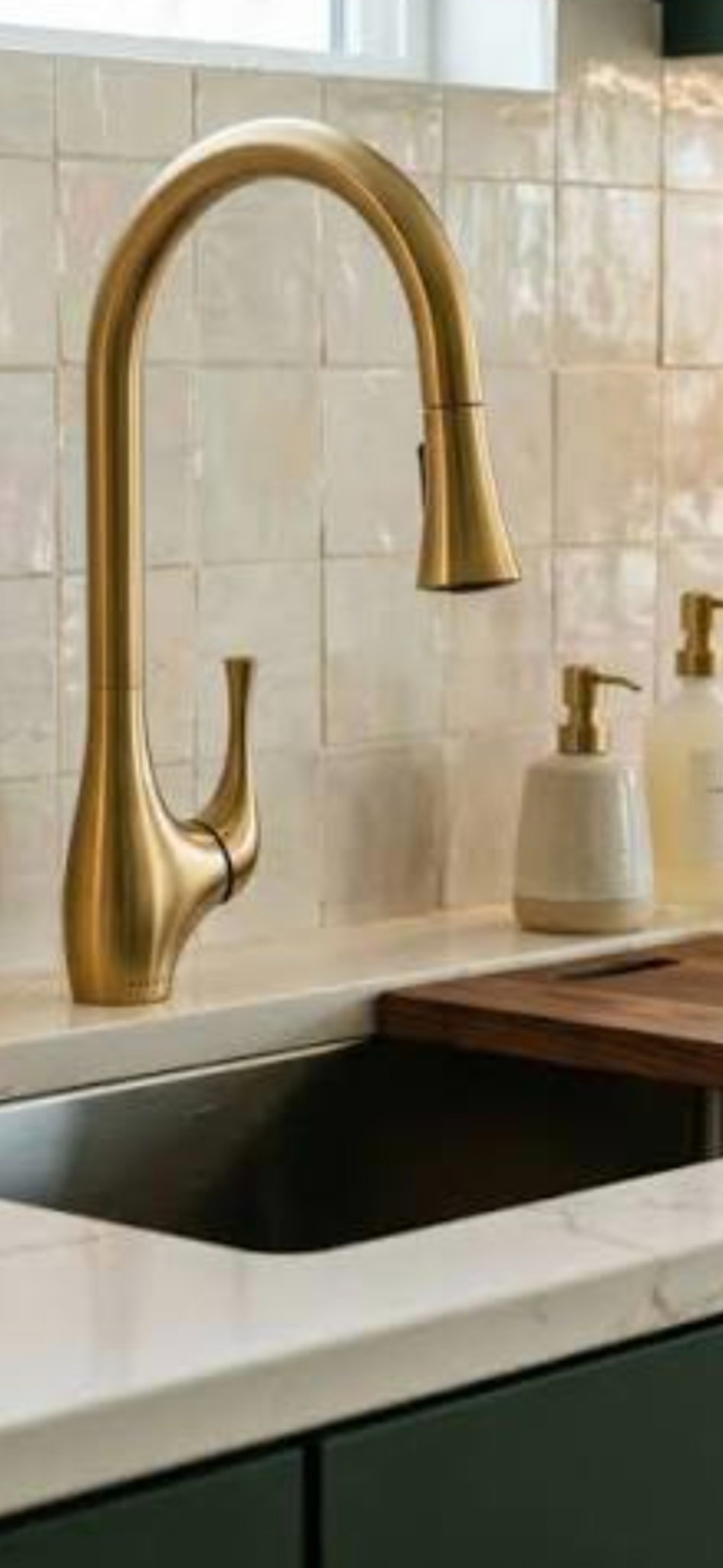 Premium brass kitchen faucet over a residential sink